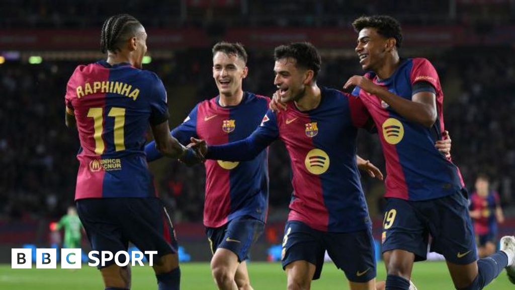 Barcelona players celebrate a goal