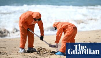 Mysterious tar balls washing ashore force closure of seven beaches in Sydney including Bondi