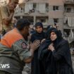 Rescue workers search for signs of missing under rubble