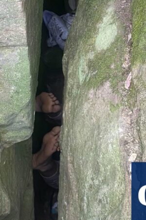 Woman wedged upside down between boulders for seven hours after trying to retrieve phone in regional NSW