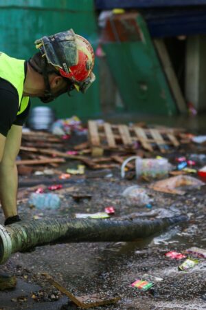 An emergency works on removing water from one of the exits of the car park. Pic: Reuters