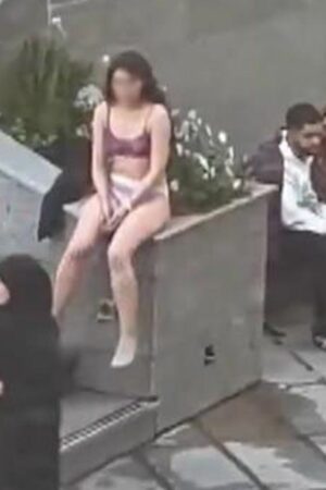 Woman 'violently arrested' after stripping to protest strict Islamic dress code - reports