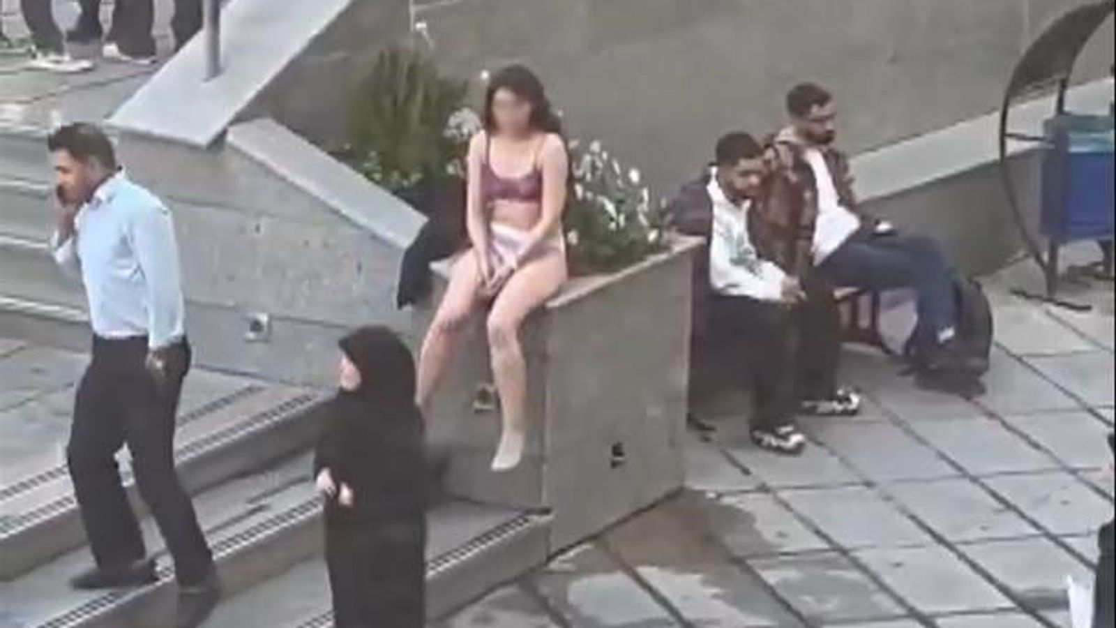 Woman 'violently arrested' after stripping to protest strict Islamic dress code - reports