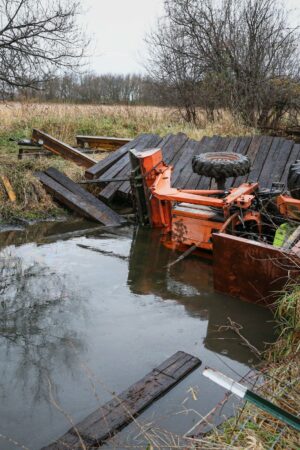 Illinois man rescued after bridge collapse causes tractor to trap him in creek