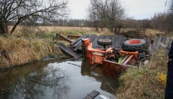 Illinois man rescued after bridge collapse causes tractor to trap him in creek