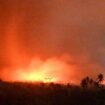 In this photo made available by Indonesia's Center for Volcanology and Geological Disaster Mitigation Agency (PVMBG) of the Ministry of Energy and Mineral Resources, the sky glows from the eruption of Mount Lewotobi Laki-Laki early Monday, Nov. 4, 2024, in East Flores, Indonesia. (PVMBG via AP)