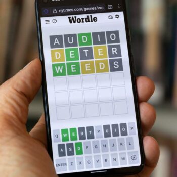 FILE - A Wordle game is seen on a mobile phone, July 15, 2022, in Boston. The New York Times is fighting off Wordle ...clones... ... arguing that numerous games inspired by the mega-popular word-guessing game infringe on its copyright protections. (AP Photo/Michael Dwyer, File)