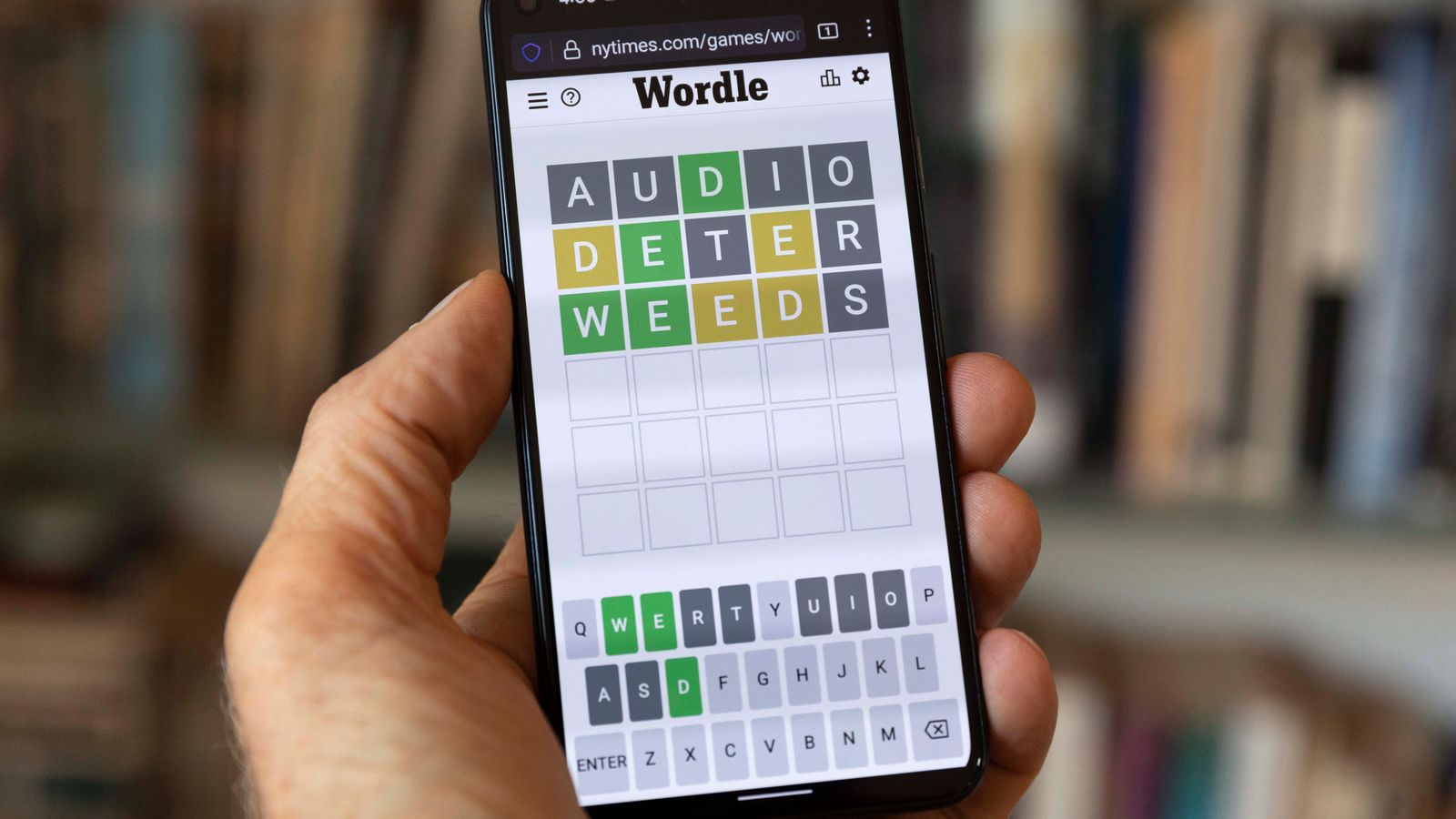 FILE - A Wordle game is seen on a mobile phone, July 15, 2022, in Boston. The New York Times is fighting off Wordle ...clones... ... arguing that numerous games inspired by the mega-popular word-guessing game infringe on its copyright protections. (AP Photo/Michael Dwyer, File)