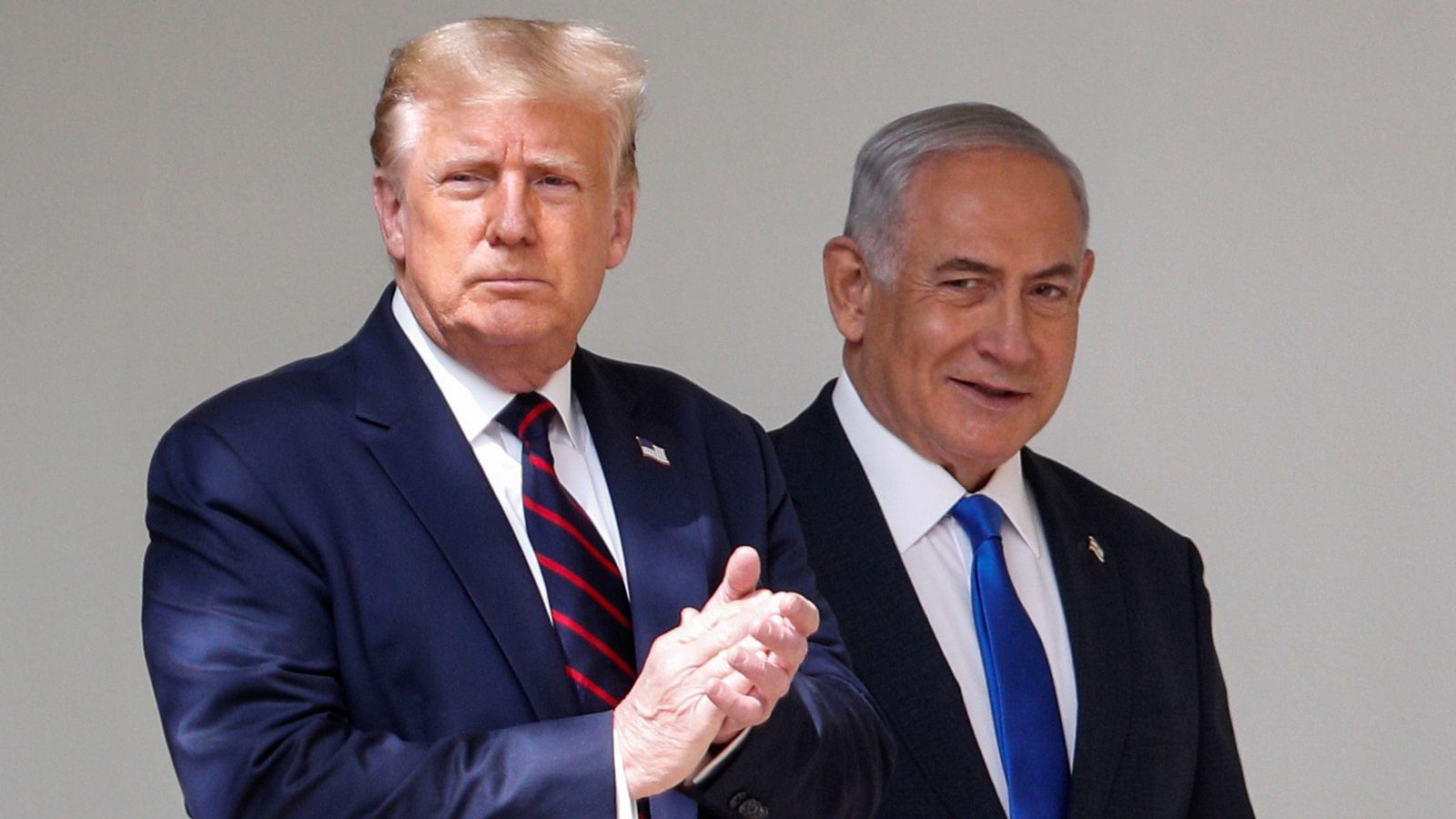 U.S. President Donald Trump applauds as he arrives with Israel's Prime Minister Benjamin Netanyahu prior to signing the Abraham Accords, normalizing relations between Israel and some of its Middle East neighbors in a strategic realignment of Middle Eastern countries against Iran, at the White House in Washington, U.S., September 15, 2020. REUTERS/Tom Brenner