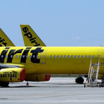 FILE - A line of Spirit Airlines jets sit on the tarmac at Orlando International Airport on May 20, 2020, in Orlando, Fla. (AP Photo/Chris O'Meara, File)