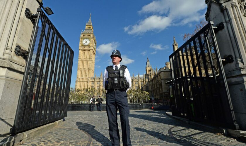 A police officer stands at the Carriage Gates entrance to parliament. File pic: PA