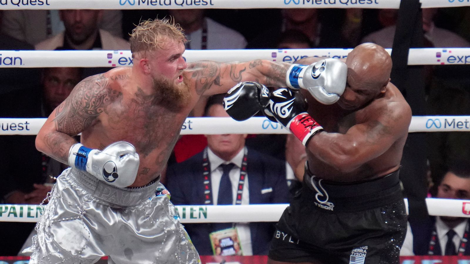 Jake Paul lands a left to Mike Tyson during their heavyweight boxing match, Friday, Nov. 15, 2024, in Arlington, Texas. (AP Photo/Julio Cortez)