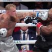 Jake Paul lands a left to Mike Tyson during their heavyweight boxing match, Friday, Nov. 15, 2024, in Arlington, Texas. (AP Photo/Julio Cortez)