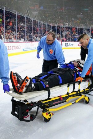 NHL ref leaves game on stretcher after colliding with Avalanche player