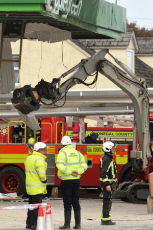 Emergency services at the scene of the explosion in the village of Creeslough, in County Donegal. Pic: Reuters