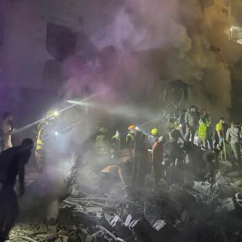 Rescue workers at the site. Pic: AP