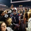 Unranked Auburn upsets CFP-hopeful Texas A&M in 4 OT thriller after game-tying score is dropped