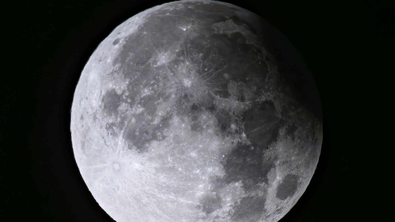 A supermoon with a partial solar eclipse rises over Brandenburg, Biegen, Germany. Pic: AP