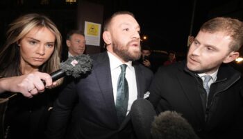 Mixed martial arts fighter Conor McGregor (centre) and partner Dee Devlin leave the High Court in Dublin after the personal injury case against him. Nikita Hand, who is also known as Nikita Ni Laimhin, alleges she was raped by McGregor in a Dublin hotel in December 2018. After deliberating for six hours and 10 minutes, the jury returned with their verdicts in the civil trial against Conor McGregor. The total amount of damages awarded to Nikita Hand by the jury was 248,603.60 euro. Picture date: Friday November 22, 2024. PA Photo. See PA story IRISH McGregor. Photo credit should read: Brian Lawless/PA Wire