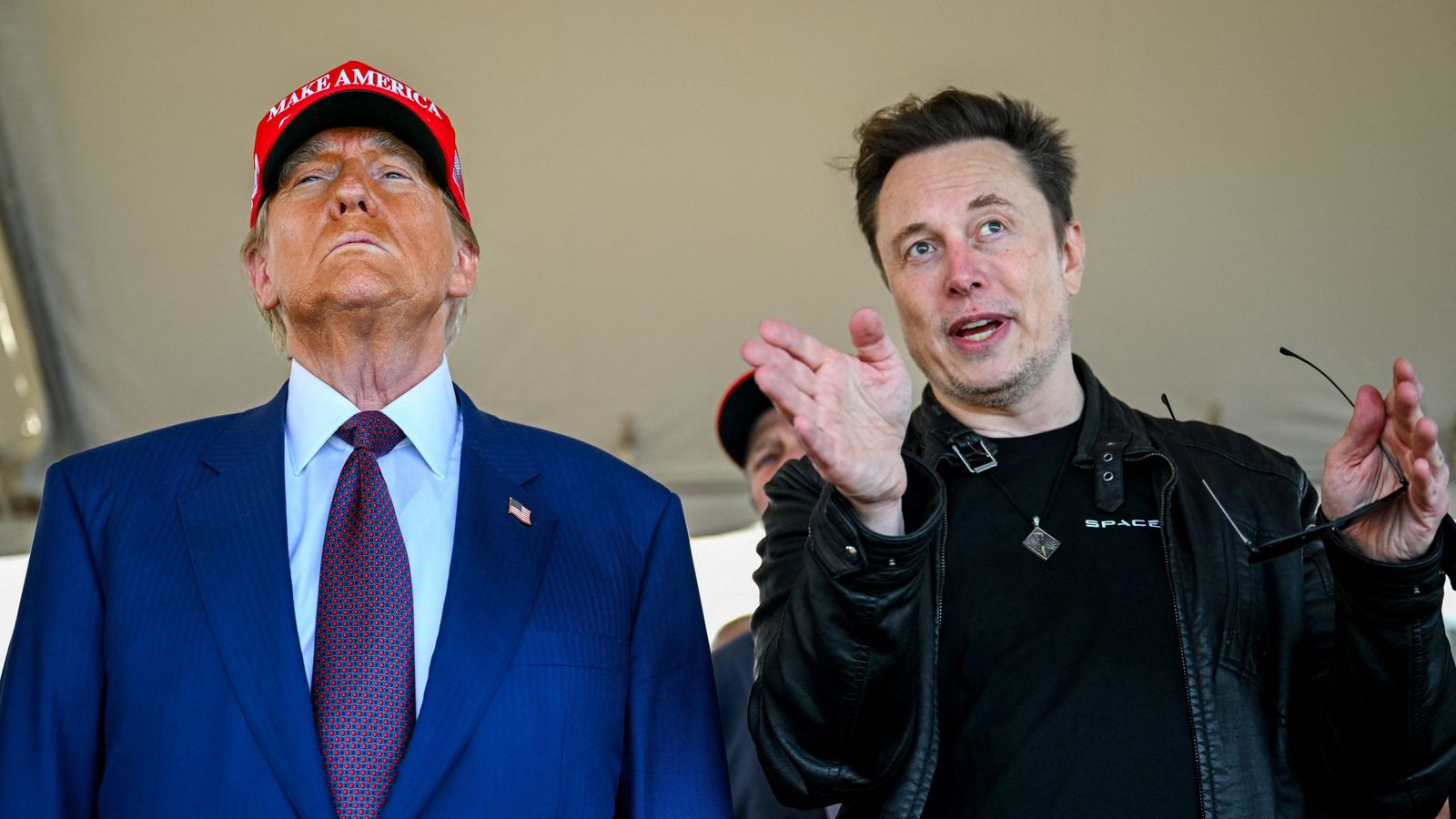 Elon Musk speaks with U.S. President-elect Donald Trump as they watch the launch of the sixth test flight of the SpaceX Starship rocket in Brownsville, Texas, U.S., November 19, 2024. Brandon Bell/Pool via REUTERS