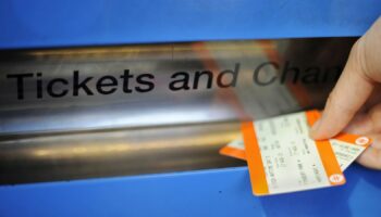 Undated file photo of a person buying a train ticket. Picture by  Lauren Hurley/PA Wire/PA Images