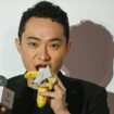 Chinese-born crypto founder Justin Sun eats a banana artwork. Pic: Peter Parks/AFP/Getty