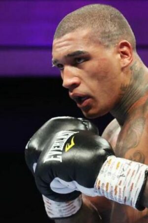 Conor Benn in black gloves during a fight