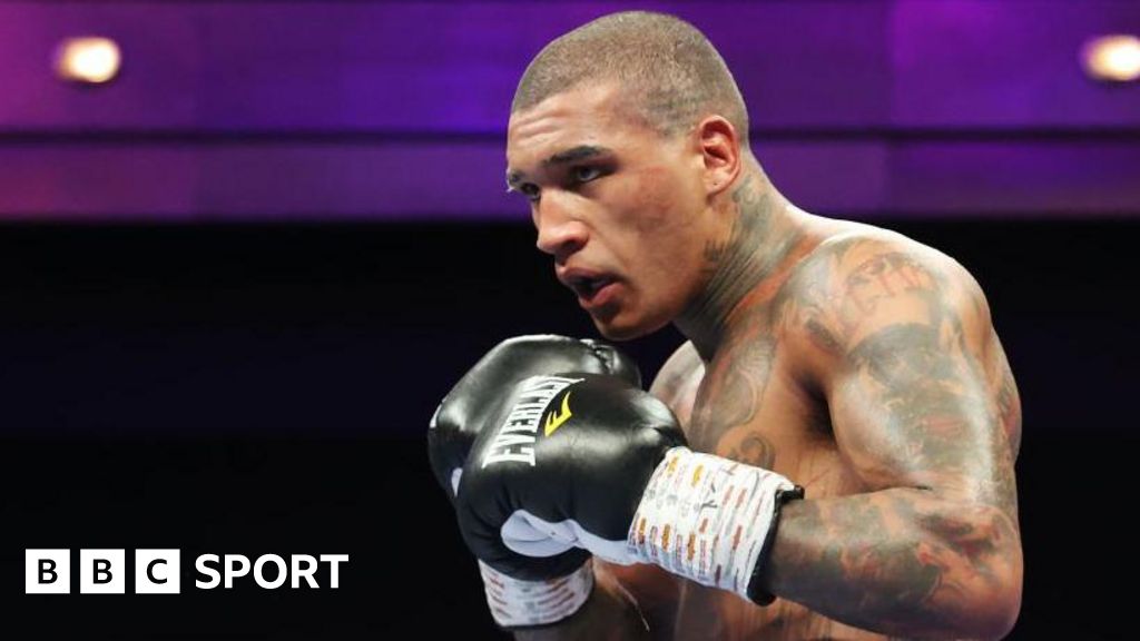 Conor Benn in black gloves during a fight