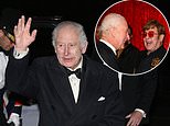 Charles' solo night at the Royal Variety Performance: Beaming King laughs with Elton John and chats with Amanda Holden, Alan Carr and Penny Lancaster at the Royal Albert Hall after unwell Queen Camilla pulled out