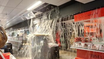 Costa del Sol floods: Rain gushes out of shop ceiling as Spain put on red alert