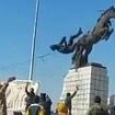 Dramatic moment Islamist rebels topple statue of Bashar Al Assad's brother as they storm Aleppo in Syrian president's biggest crisis yet - as Putin's forces hit back with airstrikes to help embattled regime