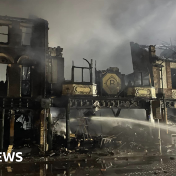 Houses evacuated after huge town centre fire