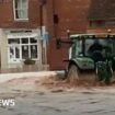 Man arrested over tractor drive through floods