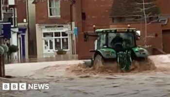 Man arrested over tractor drive through floods