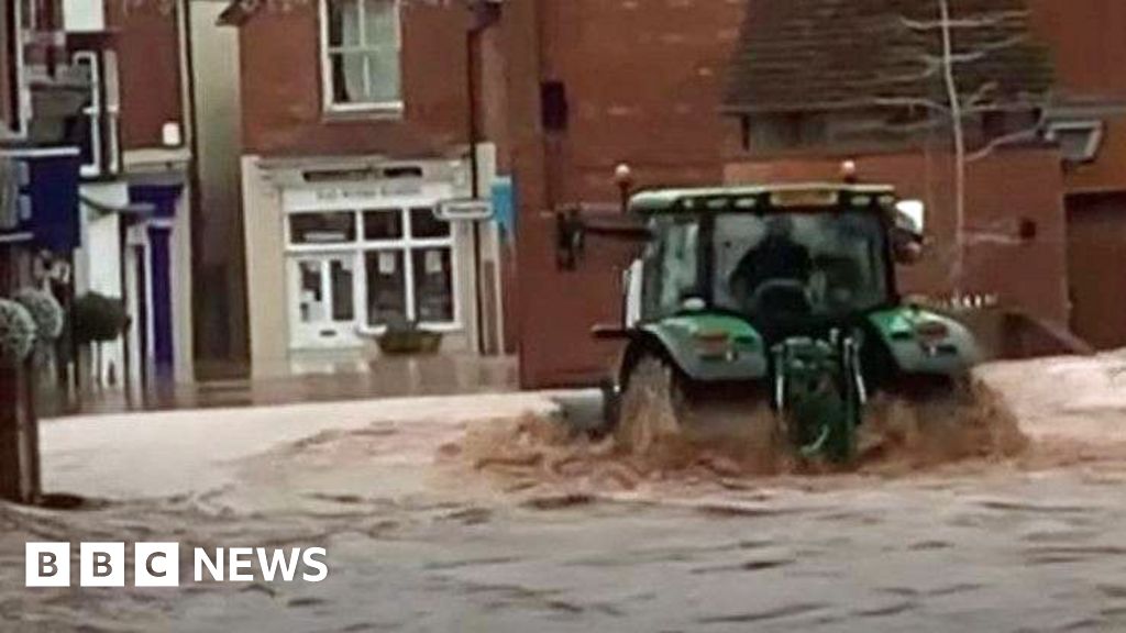 Man arrested over tractor drive through floods