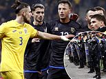 Nations League clash ABANDONED following on-pitch brawl - as one team walks off in protest in the last MINUTE after 'taking offence' from fan chants