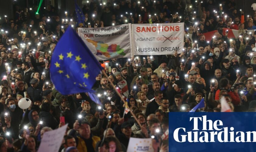 Protests in Georgia over disputed vote as PM threatens to ban opposition