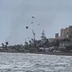 Shocking moment tornado sends debris flying on Malaga beach as footage shows the Costa del Sol hit by water spouts, floods and torrential rain in latest storms to hit Spain