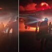 Terrifying moment passenger jet bursts into flames after horror landing in high winds