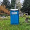 Widower says wife's grave was 'violated' as church fits portable toilet in graveyard