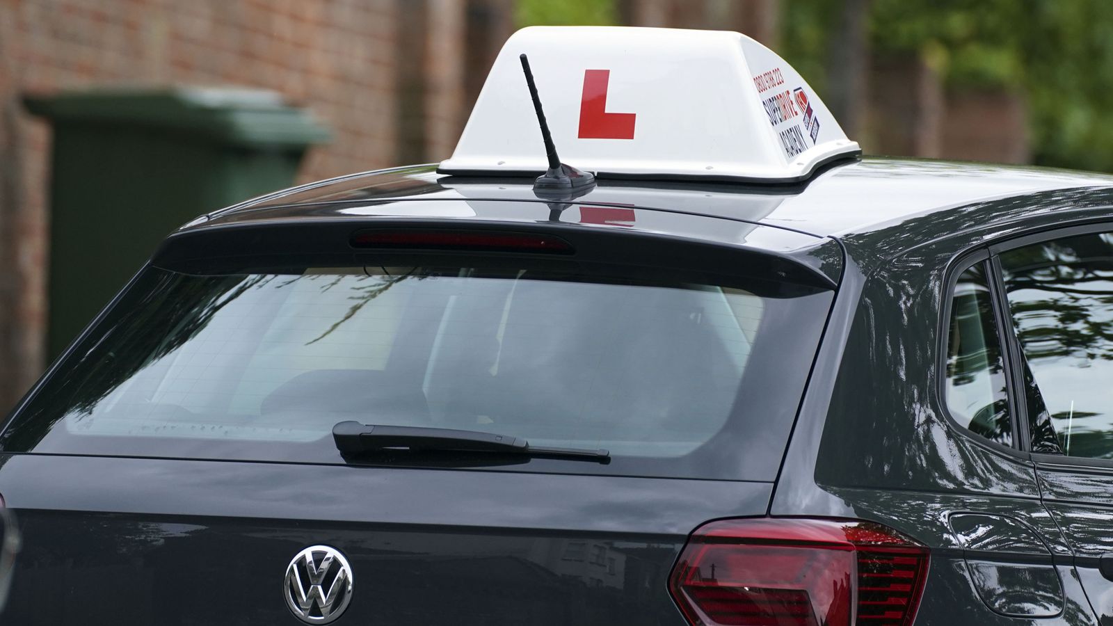 A learner driver drives down a street in Winchester, Hampshire. Picture date: Thursday May 20, 2021.