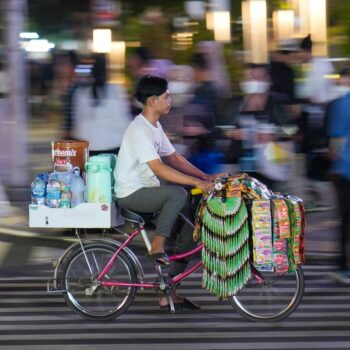 AP PHOTOS: Starlings, Indonesia's bicycle coffee sellers, peddle the streets of Jakarta