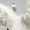 Waves crash over the seafront in Porthcawl in Wales. Millions have been warned to stay indoors, thousands are without power and trains have been cancelled as the Government's "risk to life" alert brought on by Storm Darragh came into force. Picture date: Saturday December 7, 2024. PA Photo. Photo credit should read: Ben Birchall/PA Wire