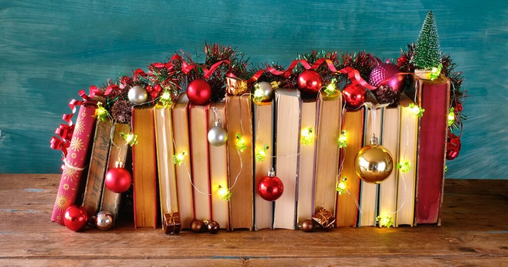 giving books for christmas,books as christmas gift,christmas present,reading,literature,education,making a gift concept, copy space