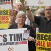 Infected blood scandal campaigners demonstrate outside Westminster in July 2023