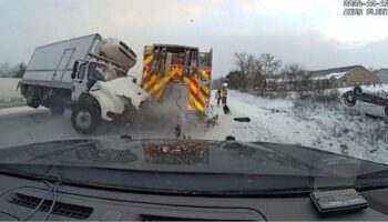 Wild dashcam video shows out-of-control truck slam into first responder vehicles on side of icy highway