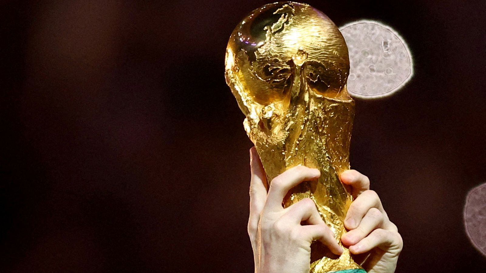 FILE PHOTO: Soccer Football - FIFA World Cup Qatar 2022 - Final - Argentina v France - Lusail Stadium, Lusail, Qatar - December 18, 2022 General view of Argentina's Lionel Messi lifting the trophy as he celebrates winning the World Cup REUTERS/Hannah Mckay/File Photo