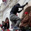 Trump supporters scale the wall of the Capitol Building in Washington DC on 6 January 2021. Pic: Reuters