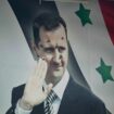 Un poster du président syrien déchu Bachar al-Assad criblé de balles, le 12 dcéembre 2024 à Alep, dans le nord de la Syrie