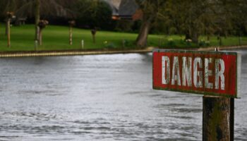 A "Danger" sign is seen on the River Thames, on the day data revealed sewage spills into England's rivers and seas by water companies more than doubled last year, in Hambledon, Britain, March 27, 2024. REUTERS/Dylan Martinez